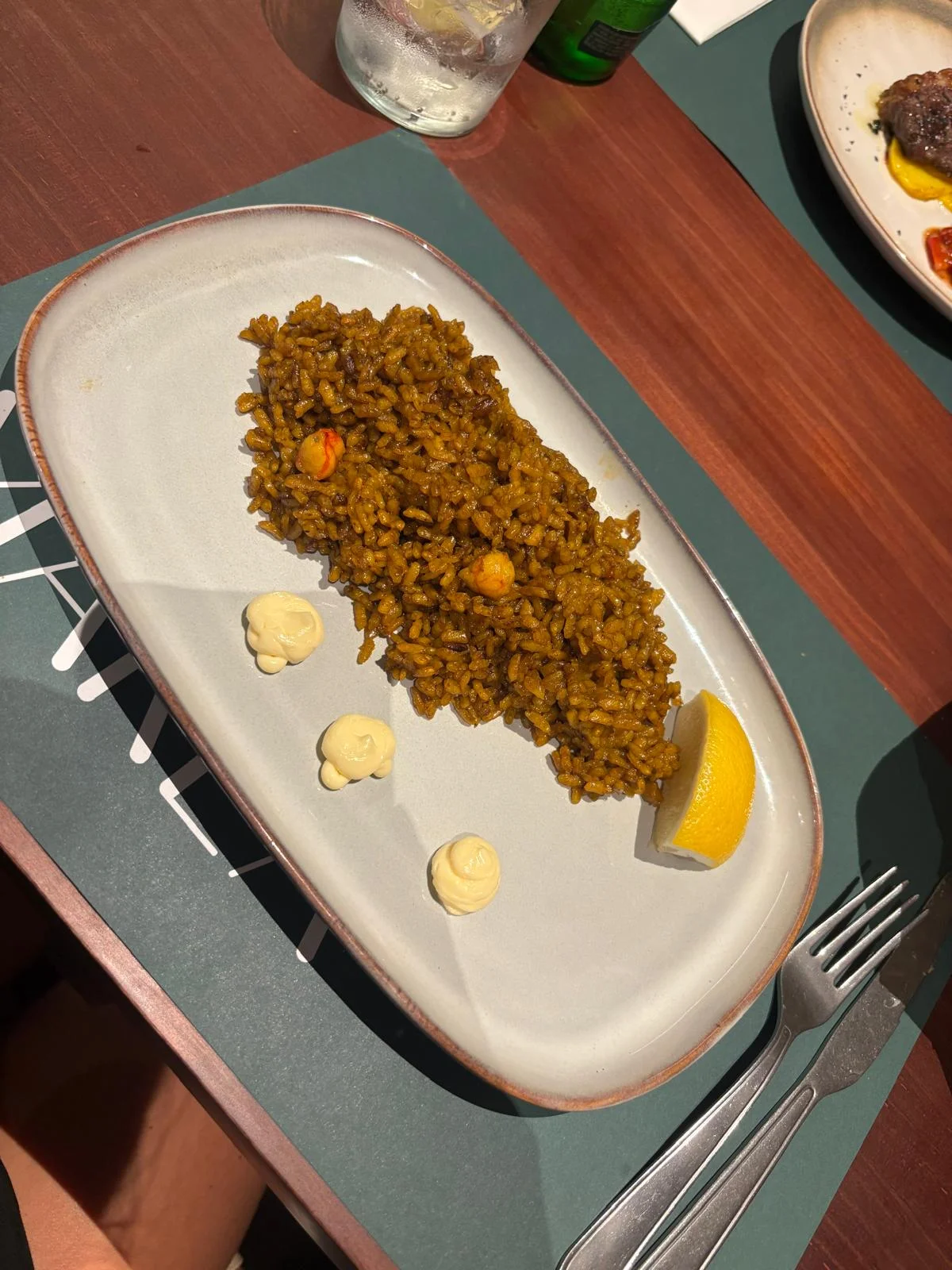 Ordinary spanish rice paella dish before AI enhancement